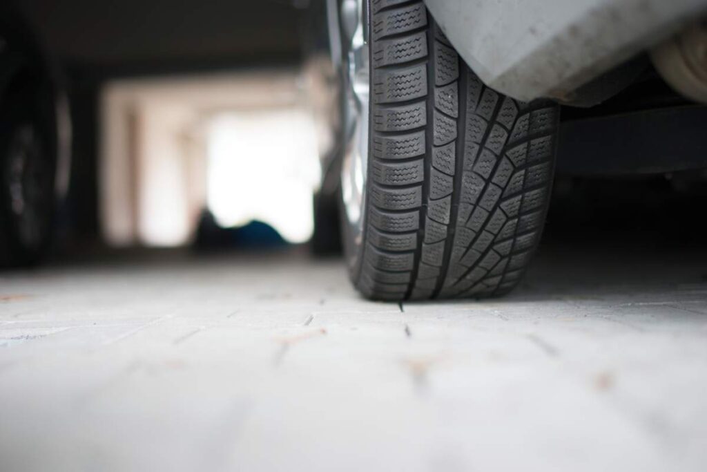 Germany, Car at underground car park, detail of tire