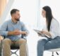 Young bearded man on wheelchair during home psychotherapy