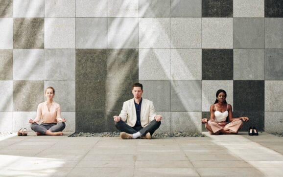 Business people in lotus position