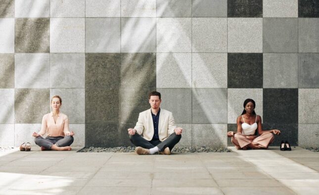 Business people in lotus position