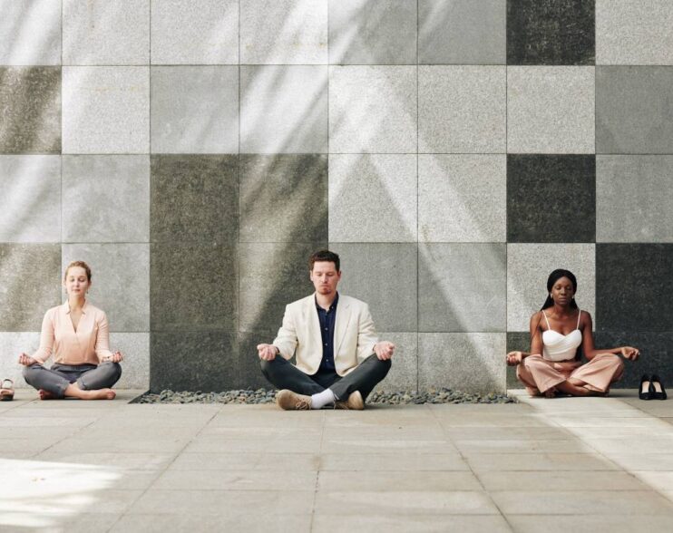 Business people in lotus position