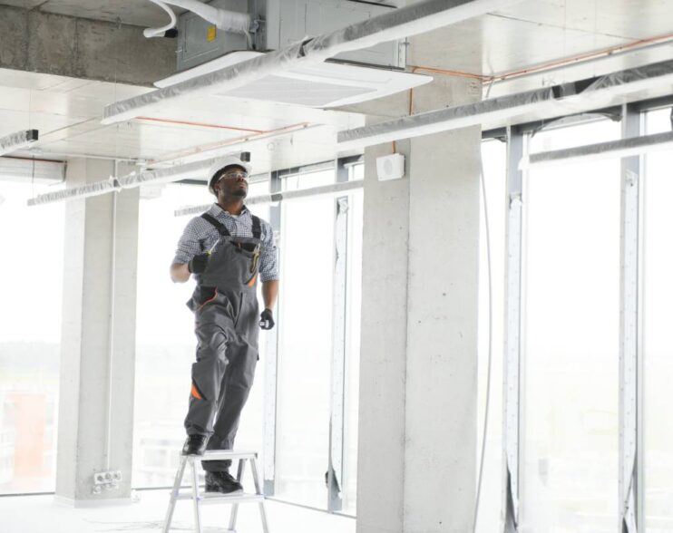 Professional repairman installing Ceilings & Partitions