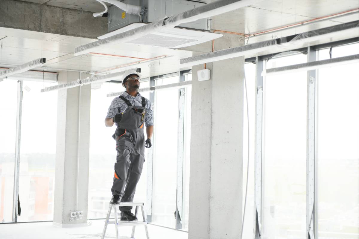 Professional repairman installing Ceilings & Partitions